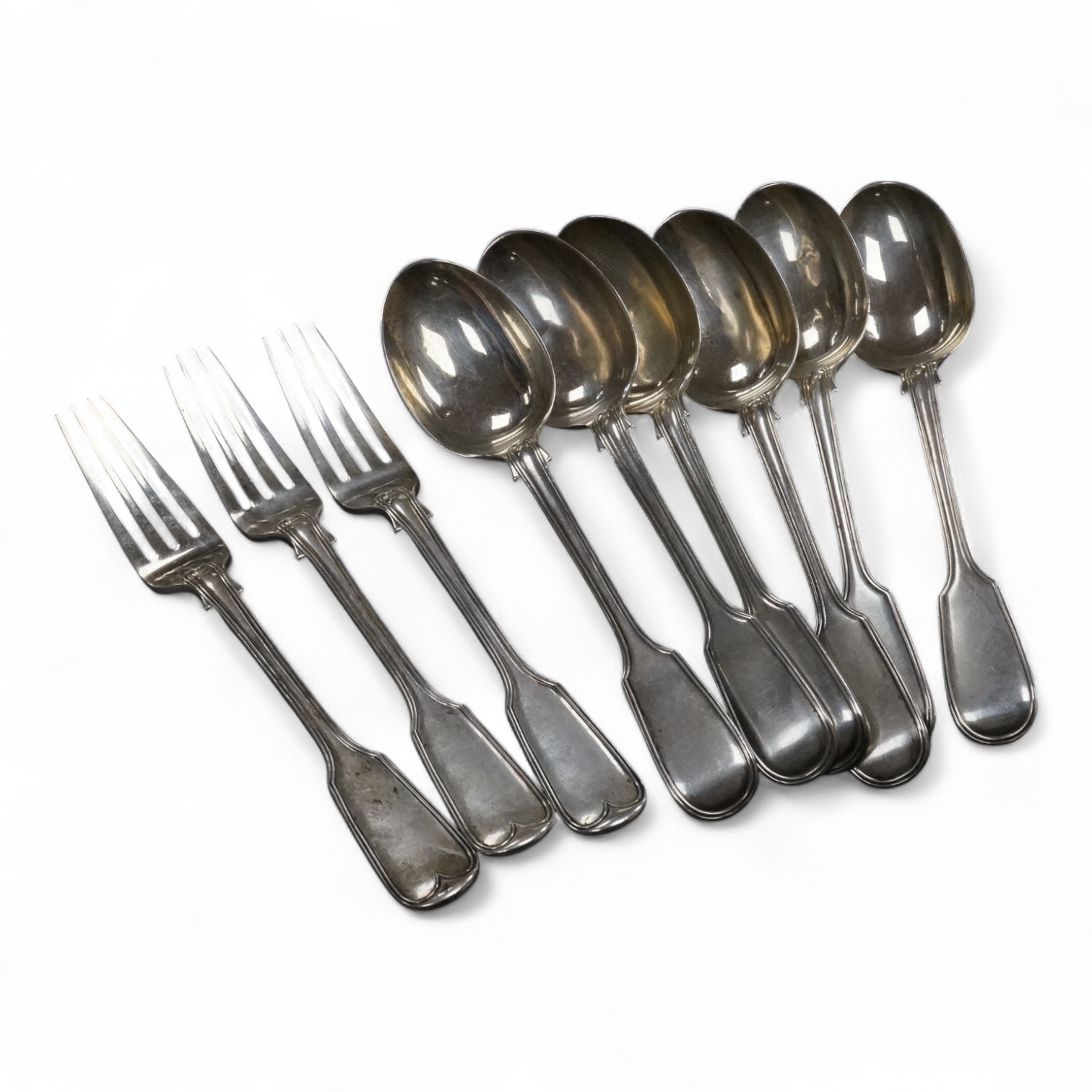A set of six Edwardian silver fiddle and thread pattern table spoons, overstruck maker's marks, possibly Goldsmiths & Silversmiths Co Ltd, 21.6cm, and three matching table forks, London, 1901, 27.9oz.